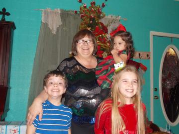 Karen with her grandchildren! On any given weekend, you can find these babies helping out around the shop!